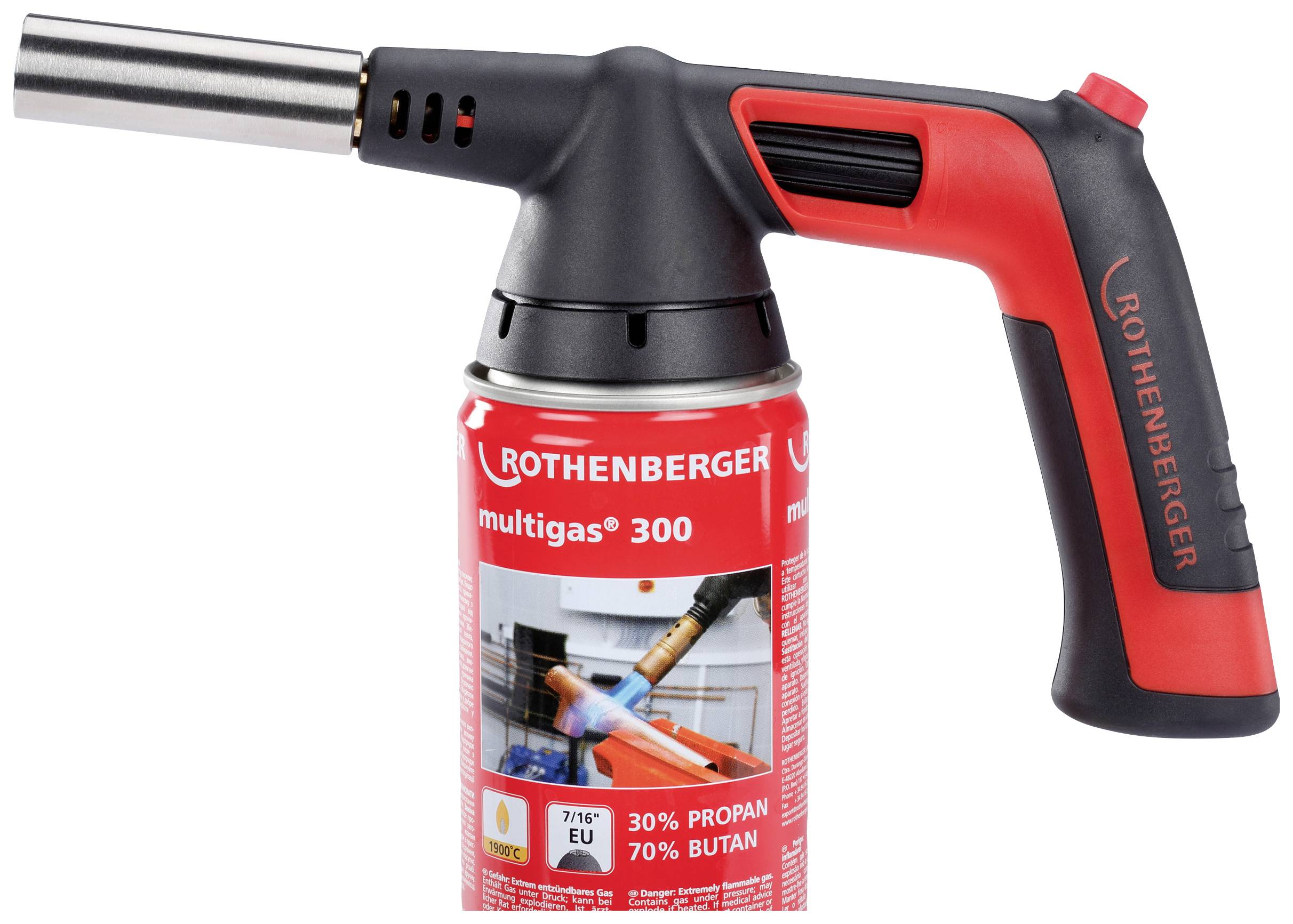 Bruciatore a gas con impugnatura rossa e nera e relativo ugello. La cartuccia è etichettata 'ROTHENBERGER multigas 300'. Utilizzato per lavori di saldatura.