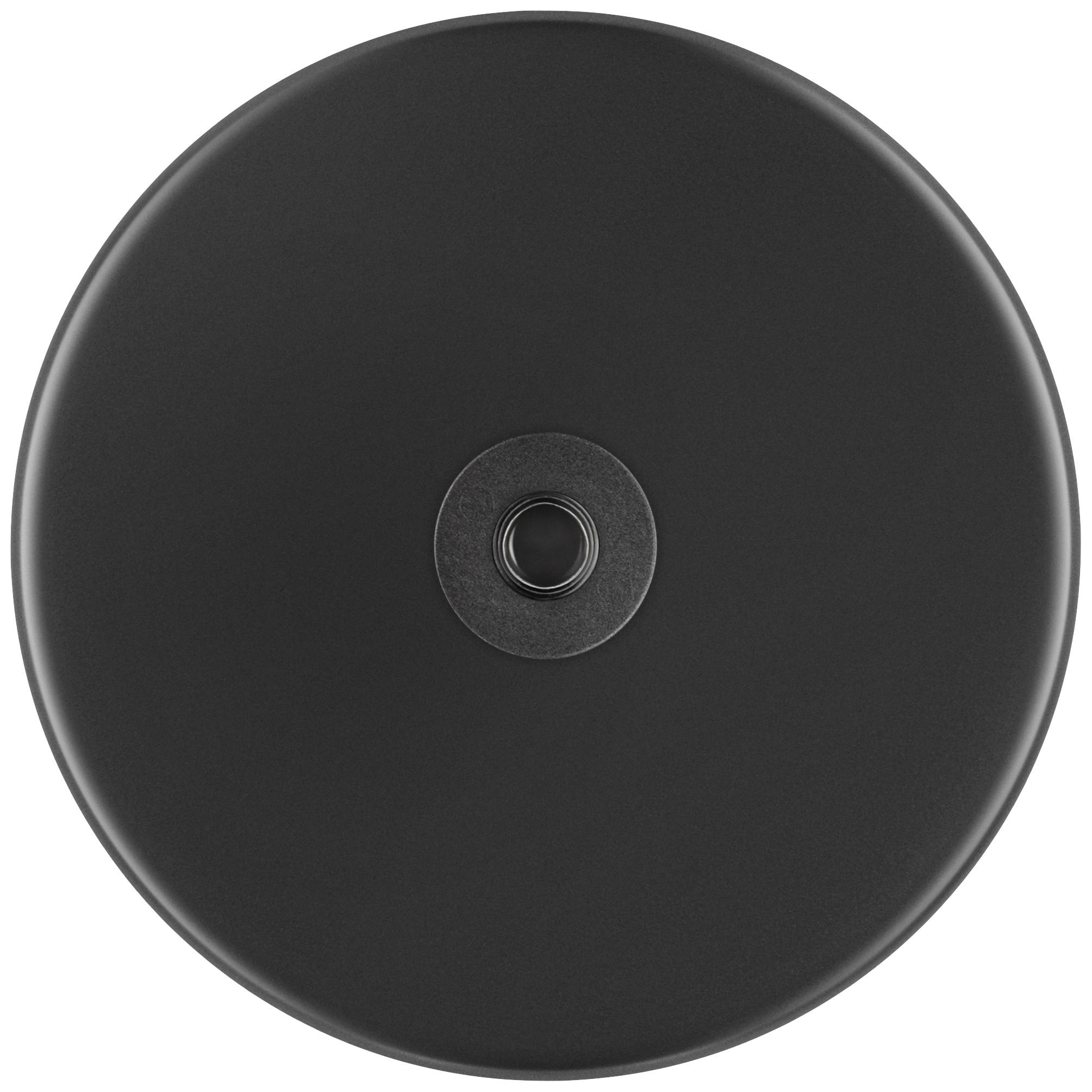 Un oggetto metallico nero e rotondo con una depressione centrale, probabilmente un coperchio o parte di un dispositivo.