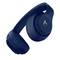 Cuffie over-ear wireless blu con un logo 'b' stilizzato sul padiglione auricolare.