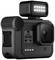Una fotocamera d'azione nera con luce LED rettangolare in alto, che mostra '4K 60W' e 'GoPro' sul display.