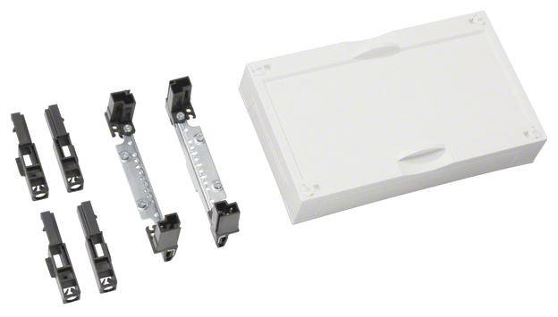 Dispositivo elettronico con connettori modulari e coperchio, composto da diversi componenti di connessione neri e una scatola bianca.
