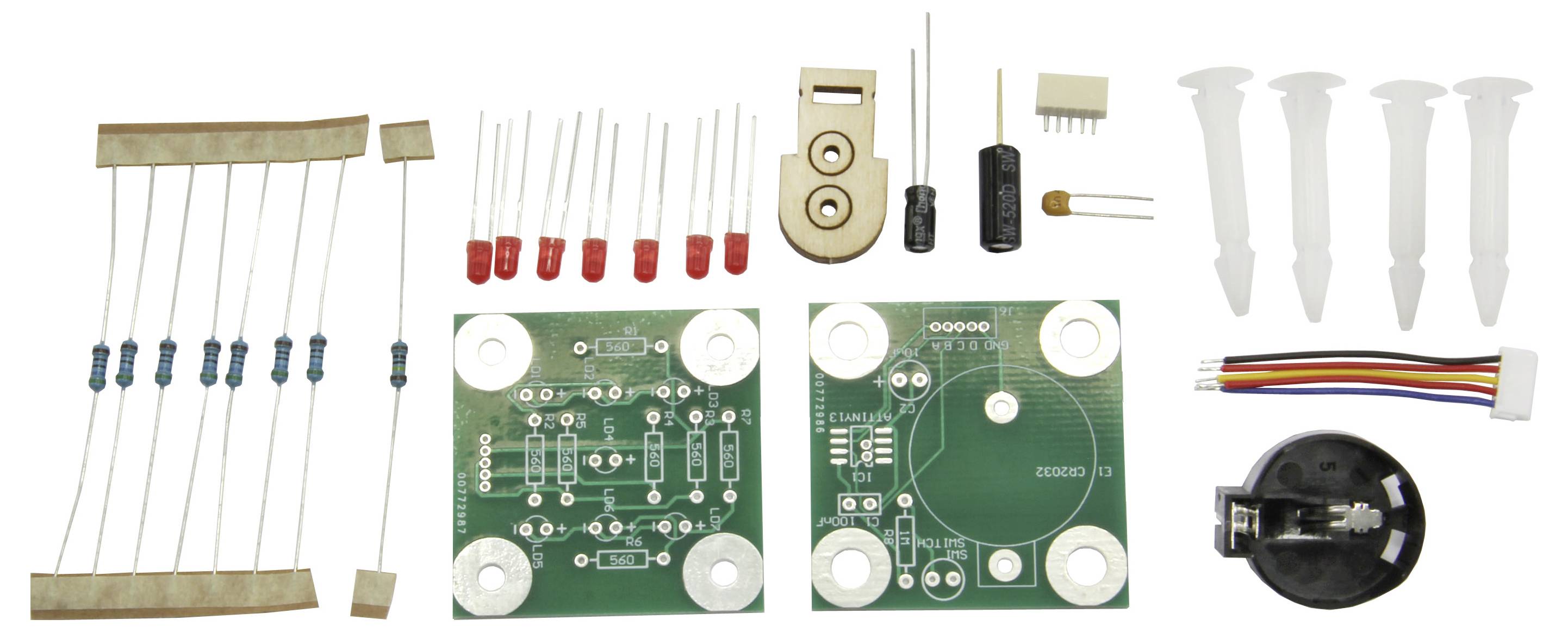 Kit elettronico con resistenze, LED, un microcontrollore, condensatori, schede elettroniche e cavi. Adatto per progetti fai-da-te.