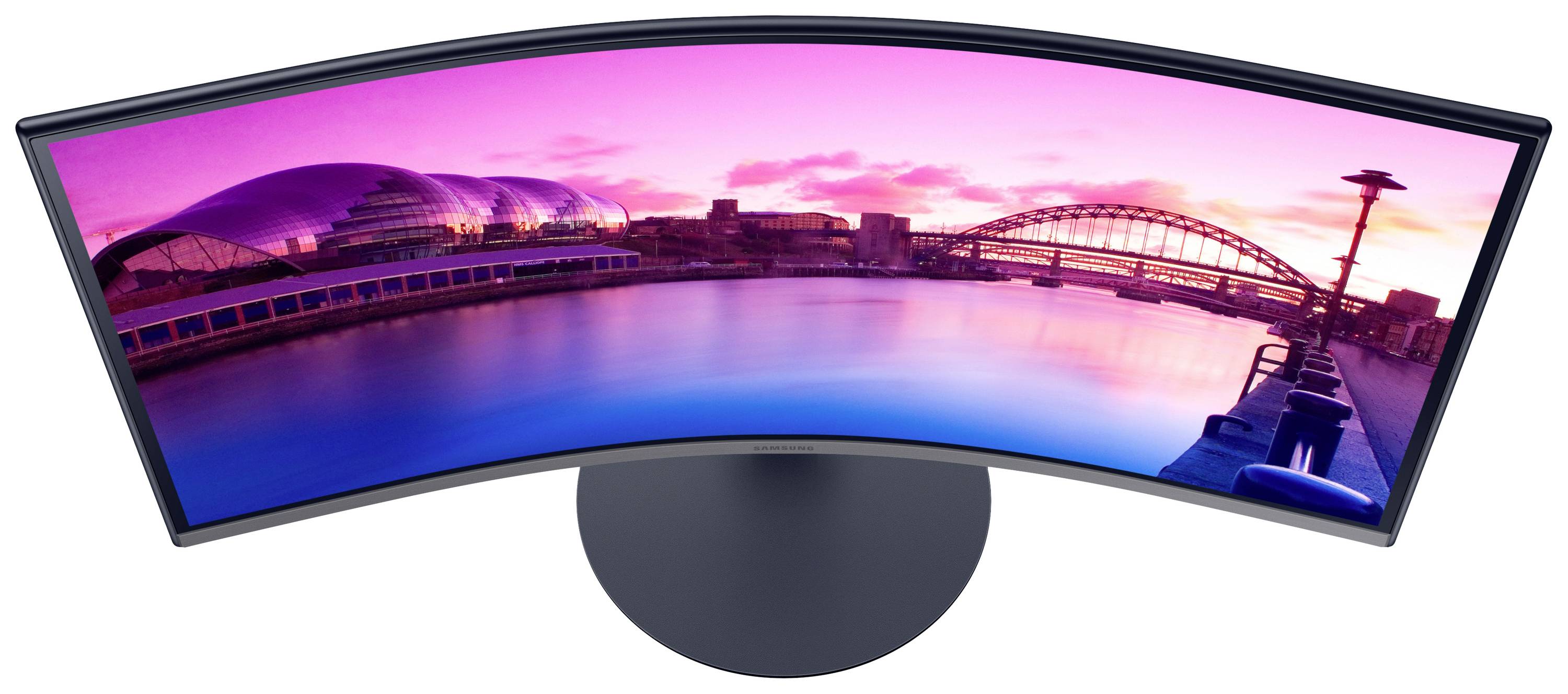 Un monitor curvo mostra un panorama urbano con un fiume, ponti e architettura moderna al tramonto.