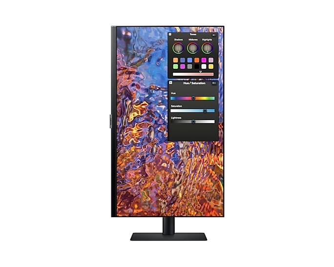 Un monitor verticale mostra un programma di editing delle immagini con una selezione di colori e cursori per tonalità, saturazione e luminosità.