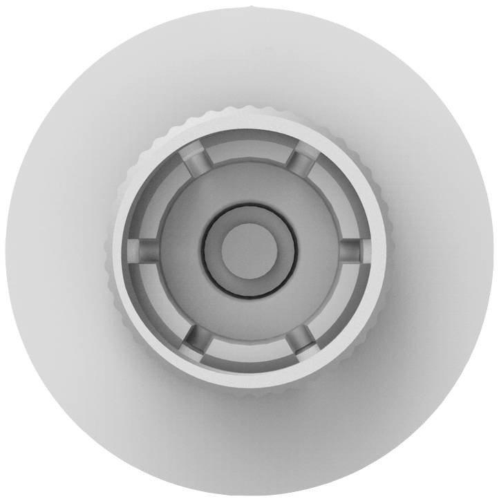 Un dispositivo grigio, circolare con anelli concentrici e incavi al centro. Componente tecnico in metallo.