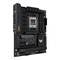 Scheda madre nera con logo 'TUF Gaming', diversi slot PCIe, slot per RAM e dissipatore di calore. Progettata per PC da gaming.