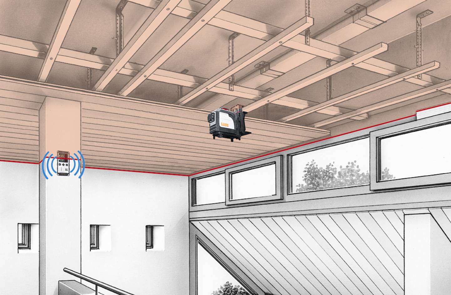 Un sistema di evacuazione del fumo montato a soffitto con finestre al piano superiore. Un dispositivo di controllo a parete gestisce l'evacuazione del fumo in modo wireless.