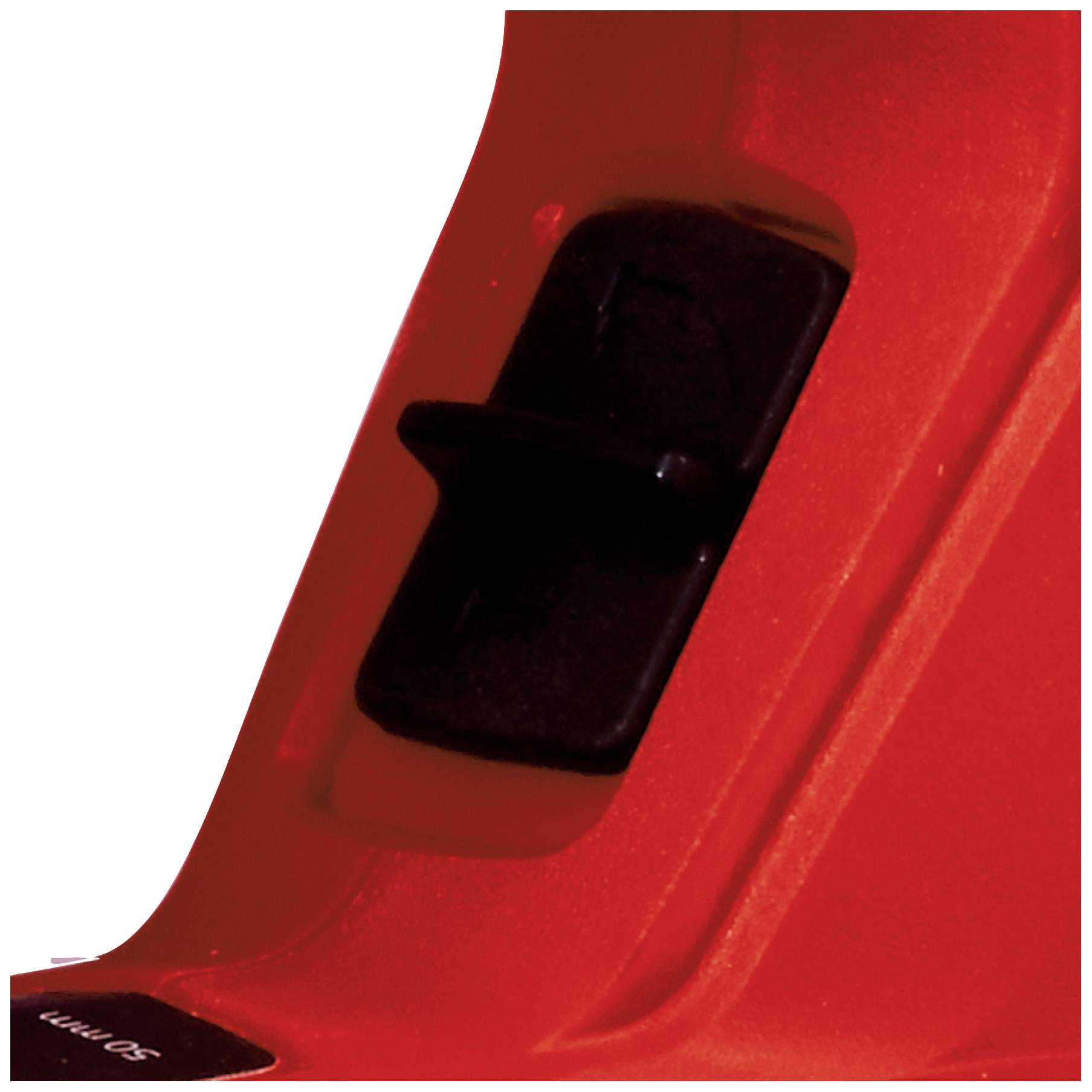 Primo piano di un attrezzo rosso con interruttore nero, probabilmente parte di un utensile elettrico o di un dispositivo.