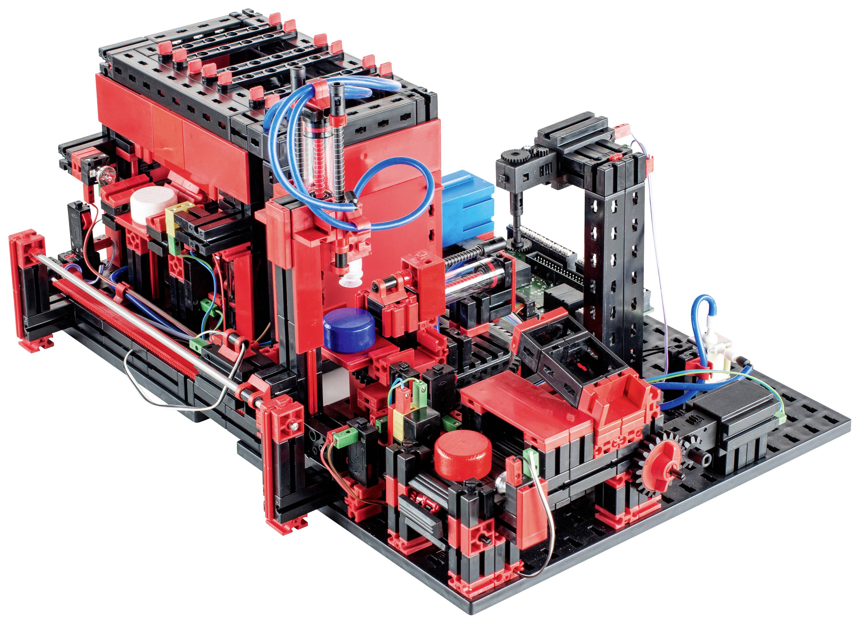Modello Lego di un impianto industriale con componenti pneumatiche e parti rosse e nere. Il set mostra dettagli tecnologici.