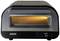 Un forno per pizza nero del marchio Unold con finestra di osservazione e display digitale. Mostra una temperatura di 400°C per la parte superiore e 200°C per la parte inferiore.