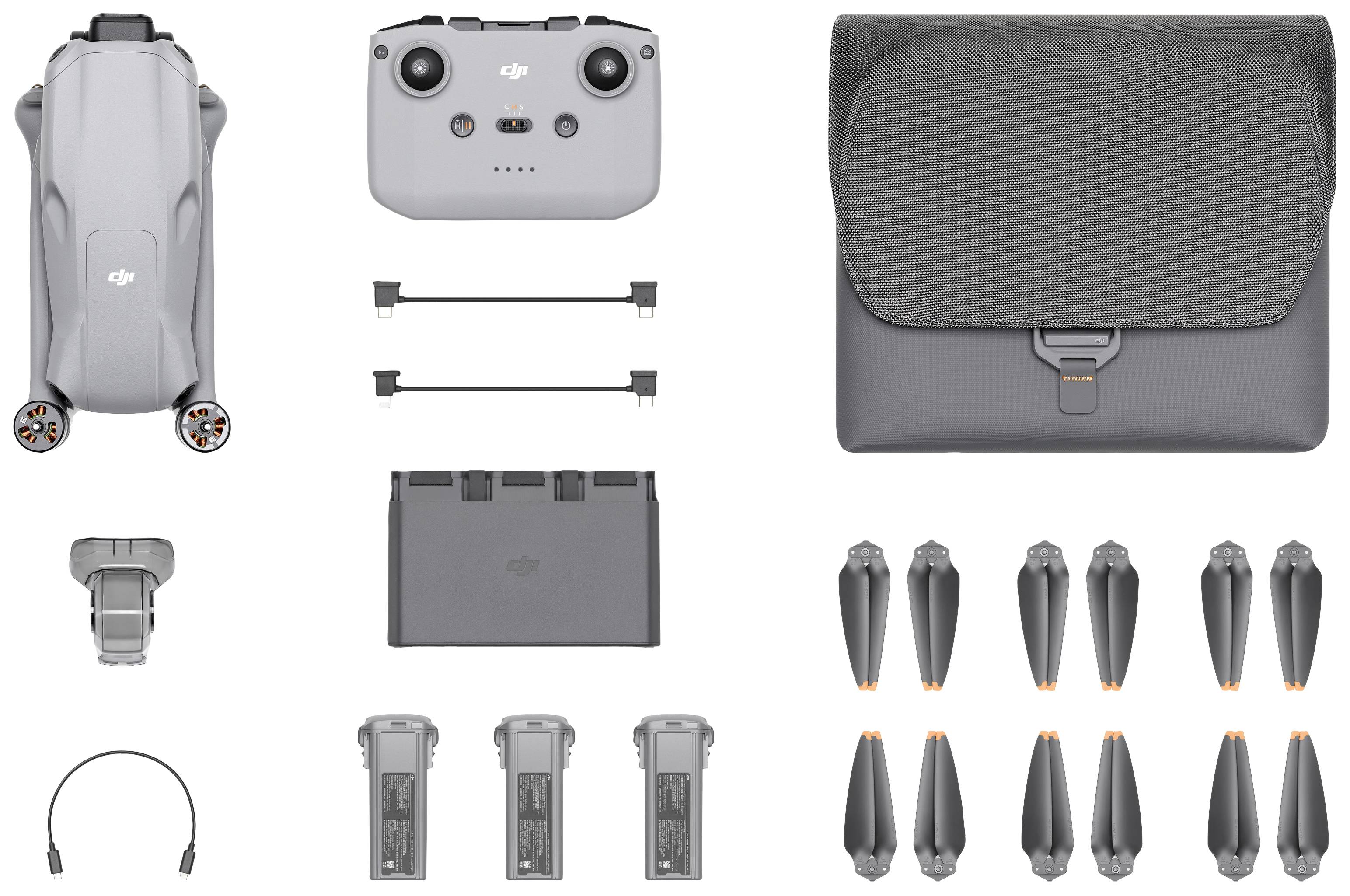 'Drone telecomandato, custodia da trasporto, eliche, batterie e accessori in colore grigio. Set completo pronto per l'uso.'