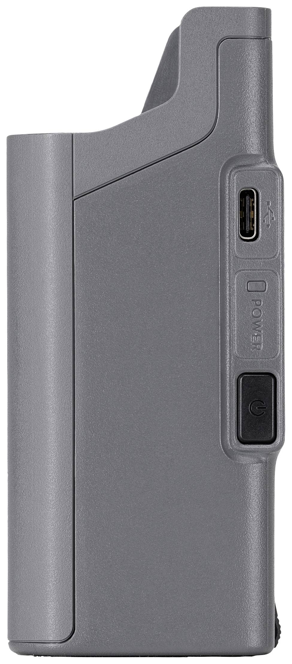 Dispositivo in plastica grigio, vista laterale. Mostra una porta USB e un altro pulsante rettangolare sotto di essa.