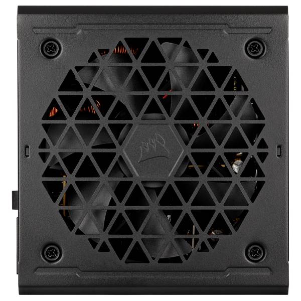 Un alimentatore nero per computer con una griglia di ventilazione a forma di triangolo. Sono visibili le pale del ventilatore e l'elettronica interna.