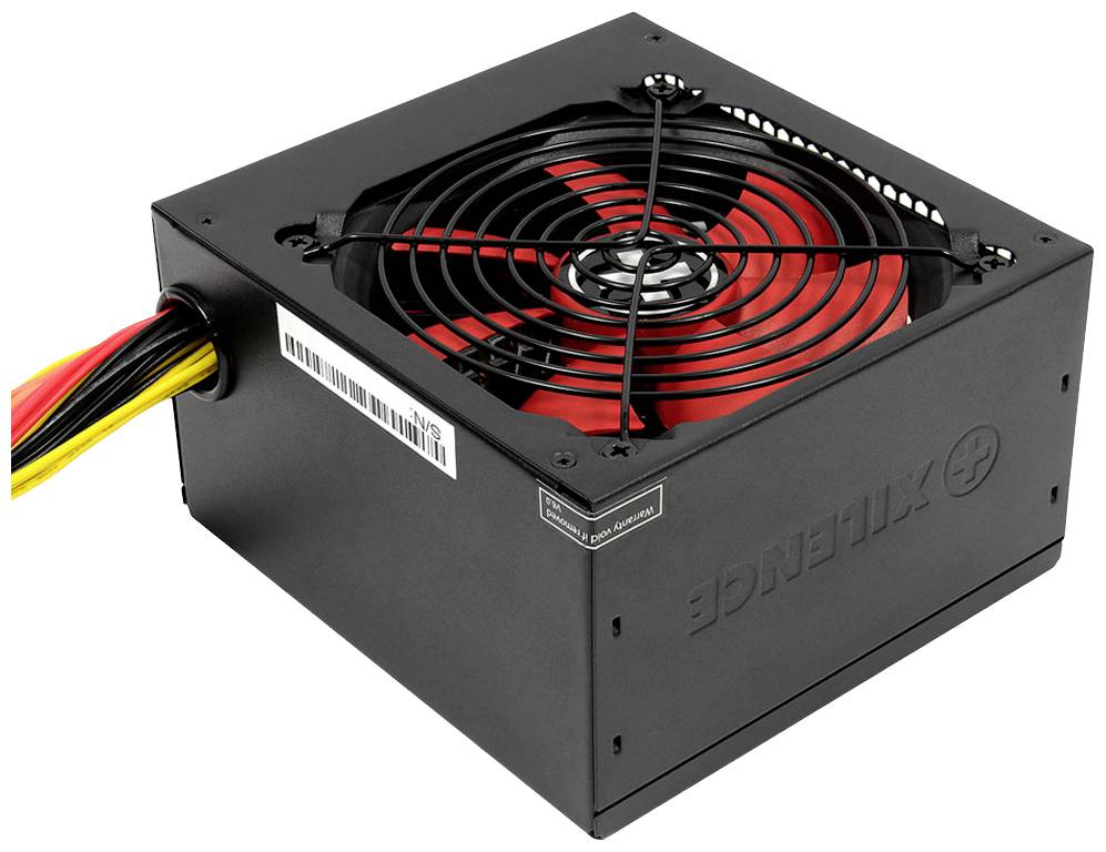 Un alimentatore nero per computer con un ventilatore rosso e diversi cavi sul lato sinistro, visibile da un angolo dall'alto.