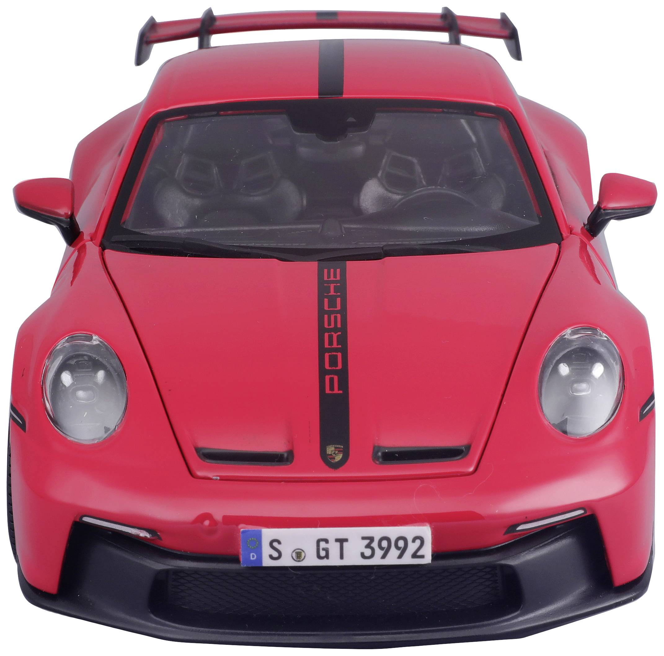 Auto giocattolo rosso in scala di un'auto sportiva, fotografato frontalmente, con la scritta 'Porsche' sul cofano e targa tedesca.