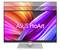Un monitor ASUS ProArt mostra uno sfondo vivace e colorato con linee ondulate in tonalità di rosso, arancione e lilla.