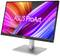 Un monitor Asus con la scritta 'ASUS ProArt' mostra uno sfondo vivace e colorato con linee dinamiche rosa e blu.