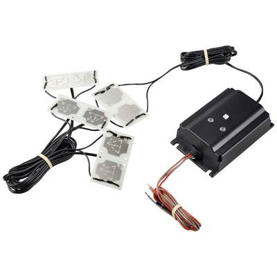 Componente elettronica nera con diversi cavi, collegata a quattro pad sensore rettangolari. Utilizzata per il controllo del riscaldamento.