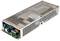 Alimentatore in un involucro metallico con fessure di ventilazione e componenti elettroniche visibili su un circuito stampato.
