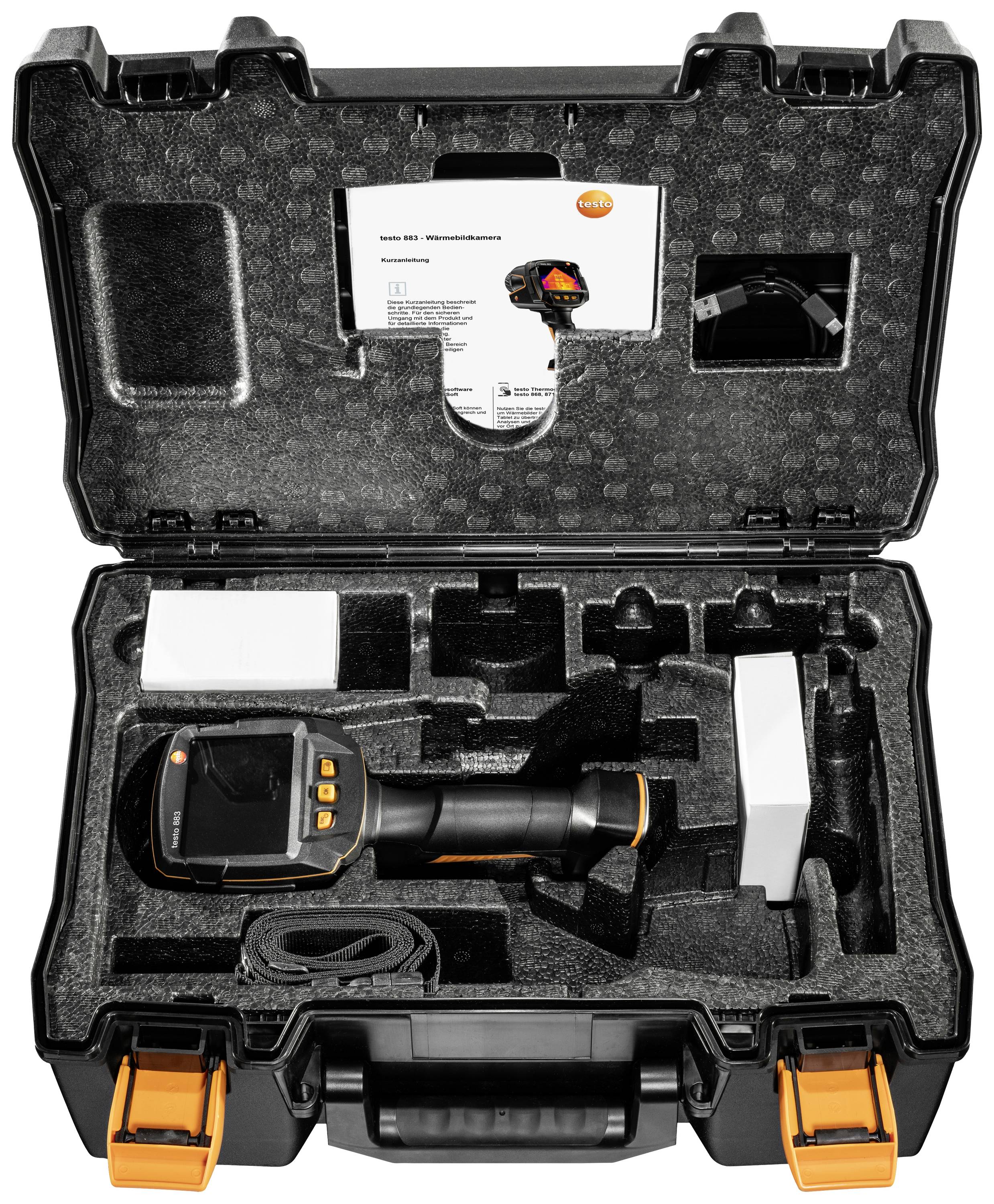Una valigia aperta con una termocamera e accessori in schiuma sagomata. Un manuale è riposto nel coperchio della valigia.