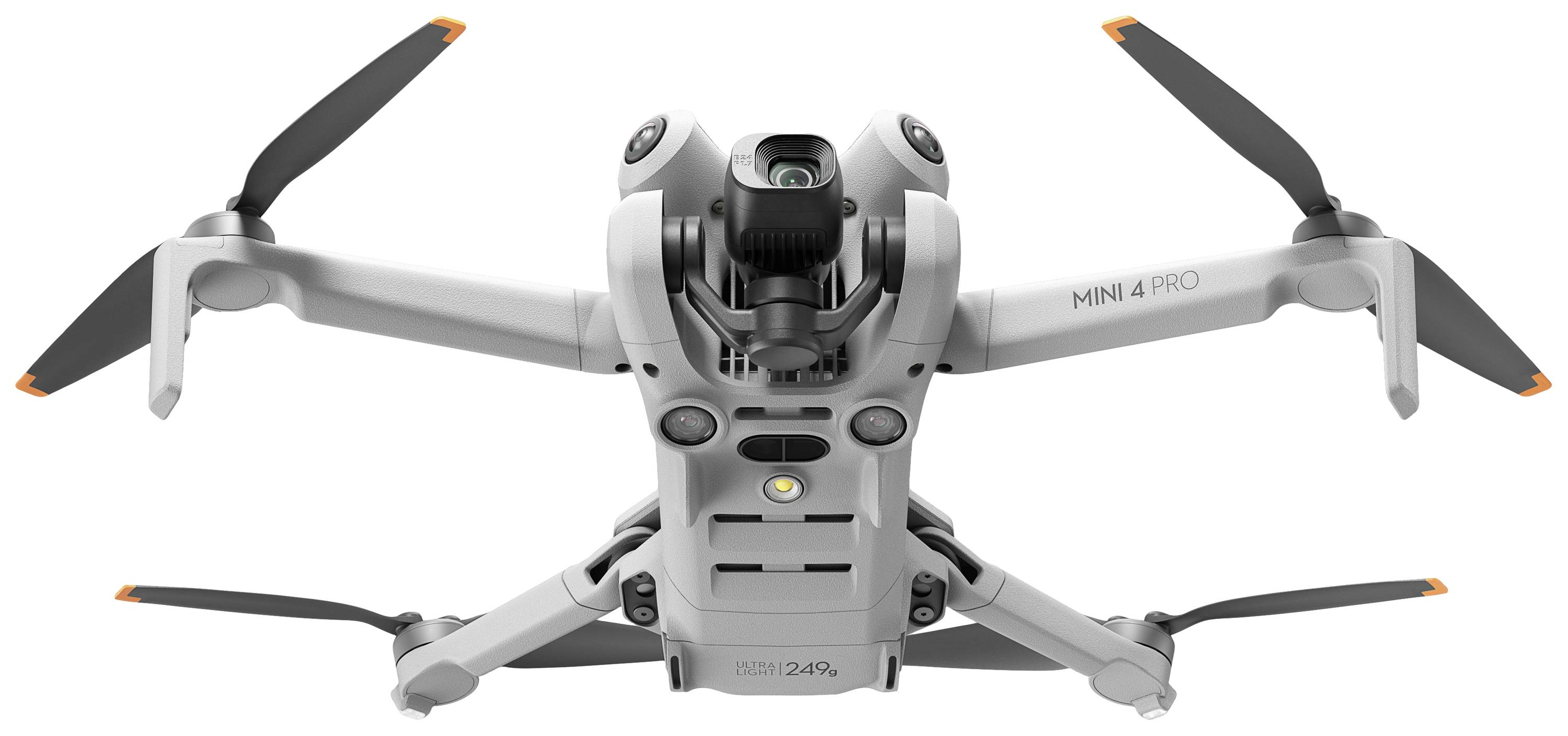 Drone autonomo in volo con involucro grigio e quattro eliche. La denominazione del modello 'MINI 4 PRO' è visibile.