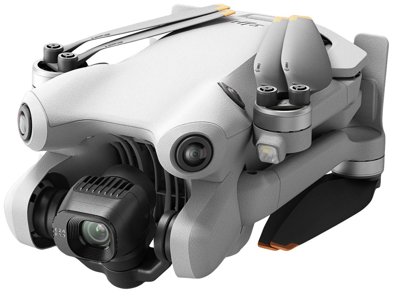 Un drone quadricottero grigio con fotocamera, compatto e ripiegabile per il trasporto. Adatto per riprese aeree e fotografia.