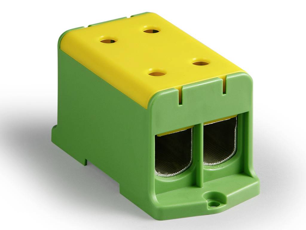 Un connettore rettangolare in plastica verde e gialla con quattro fori e due prese, utilizzato per connessioni elettriche.