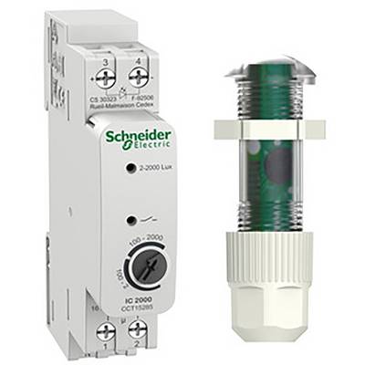 Un modulo di controllo di Schneider Electric con quadranti per impostazioni da 2-2000 Lux, affiancato da un sensore cilindrico.