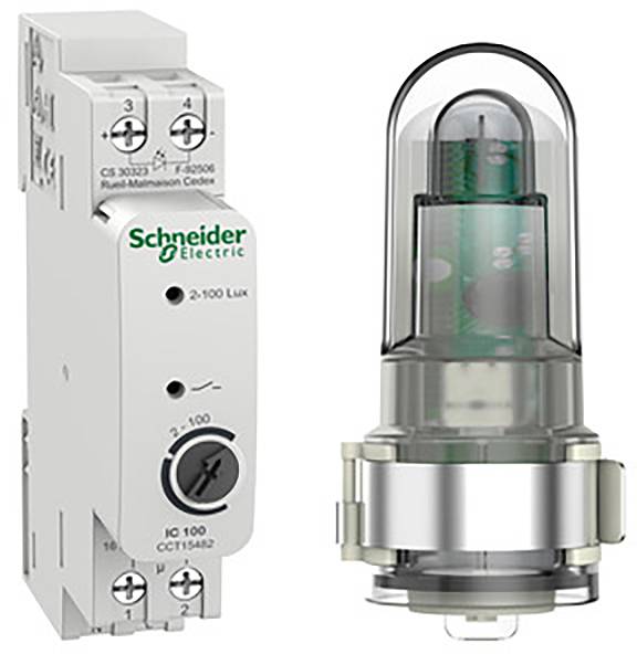 L'immagine mostra un relè fotosensibile di Schneider Electric, numero di modello CS 3023 Z4. Accanto ad esso un sensore corrispondente con cupola in vetro.