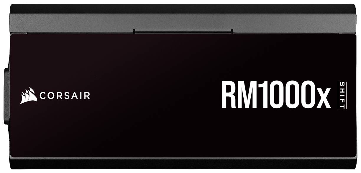 Un alimentatore Corsair RM1000x Shift, nero, di forma rettangolare, che mostra la denominazione del modello e il logo del marchio sul lato frontale.