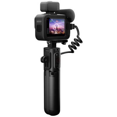 Videocamera d'azione con microfono e treppiede, mostra un display colorato con tracce luminose. Ideale per vlog o riprese in movimento.