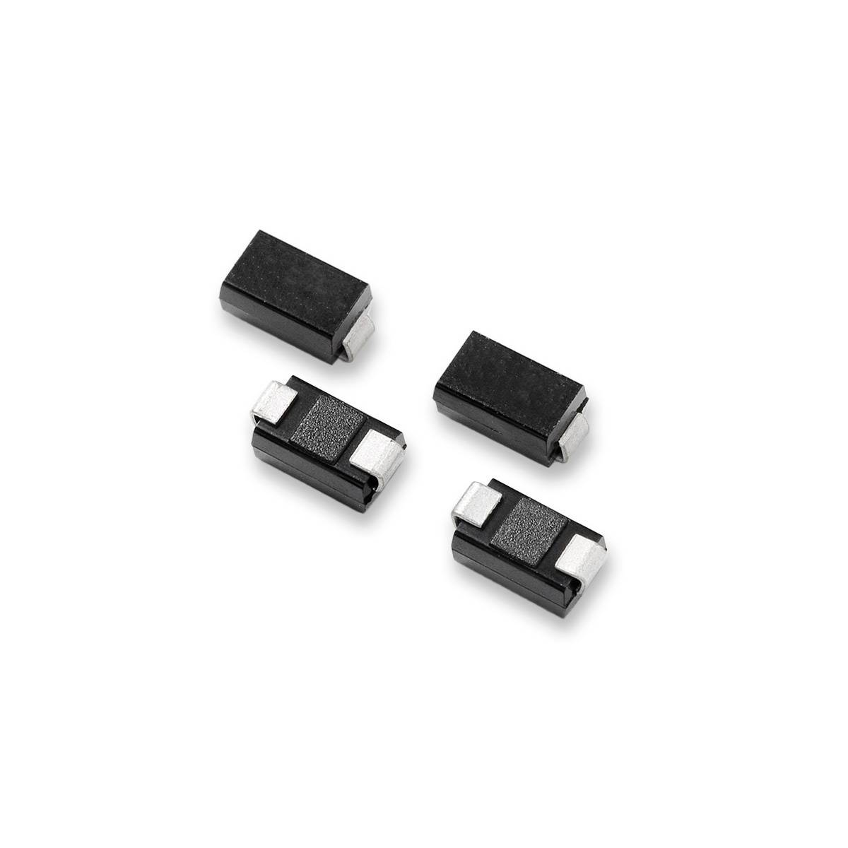 Quattro diodi rettangolari neri con contatti argentati, distribuiti su sfondo bianco.