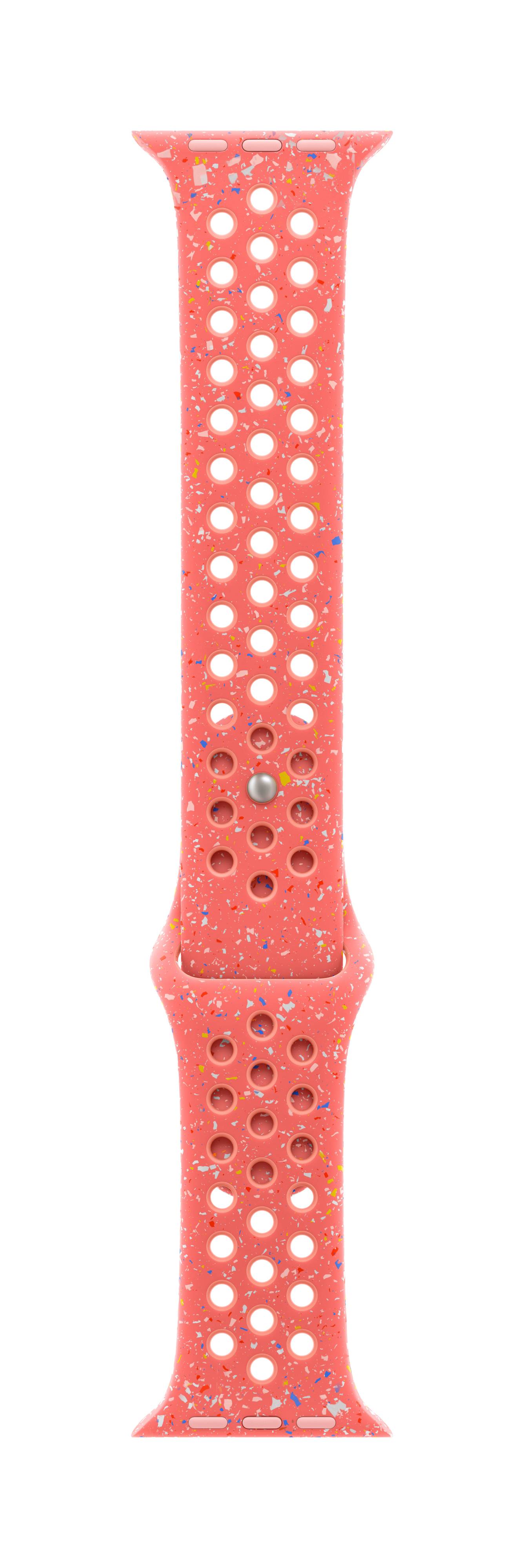 Cinturino dell'orologio rosso con molti fori rotondi e macchie colorate.