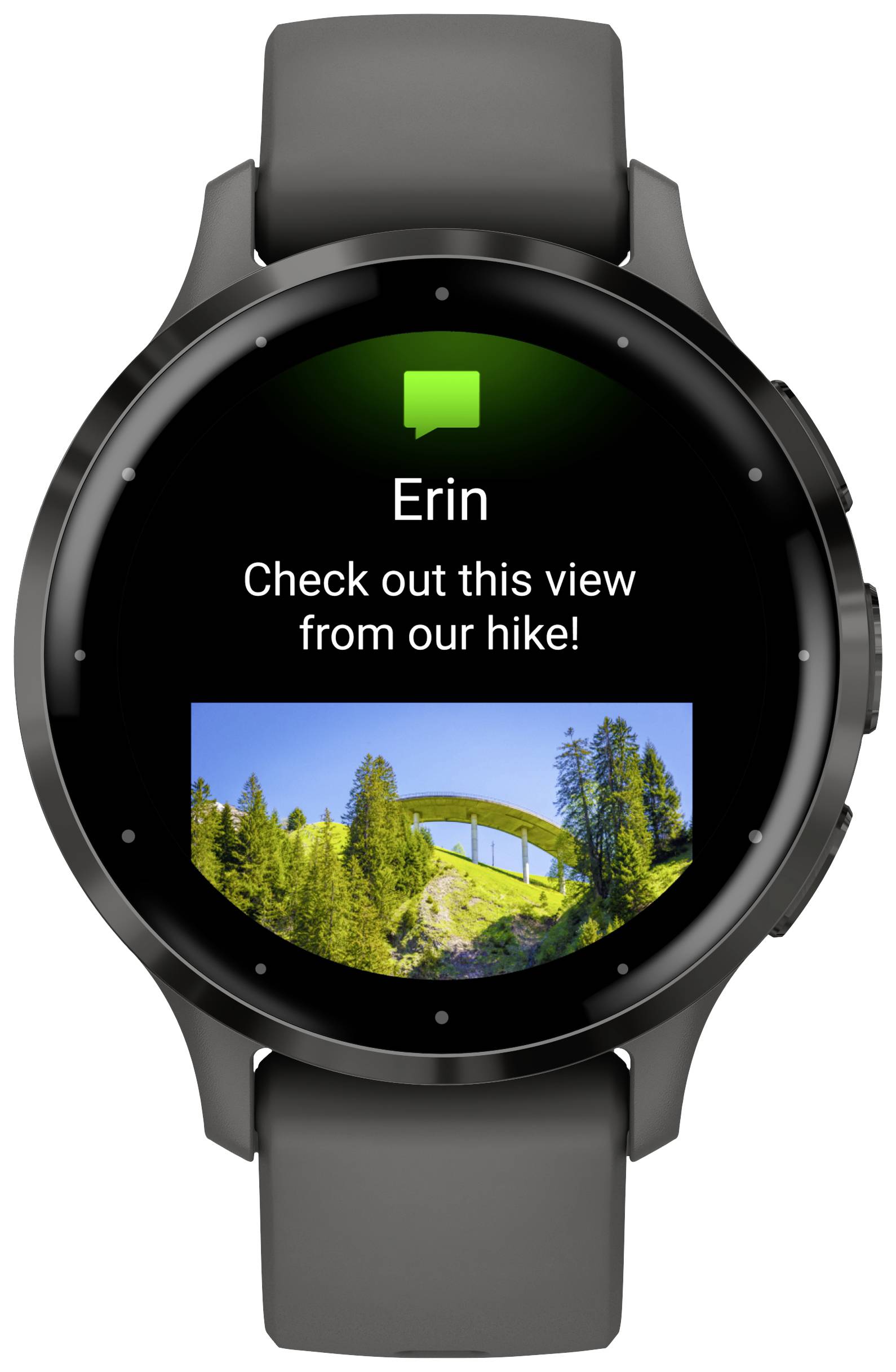 Lo smartwatch mostra un messaggio di Erin: "Guarda questa vista dal nostro trekking!" con una foto di una scena boschiva e un ponte.