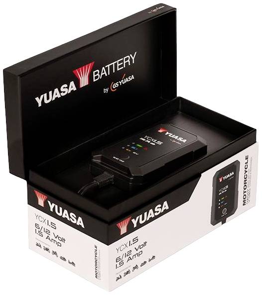Caricabatterie Yuasa in scatola aperta, idoneo per batterie da 12 volt, con indicatore LED per lo stato di carica e la manutenzione.