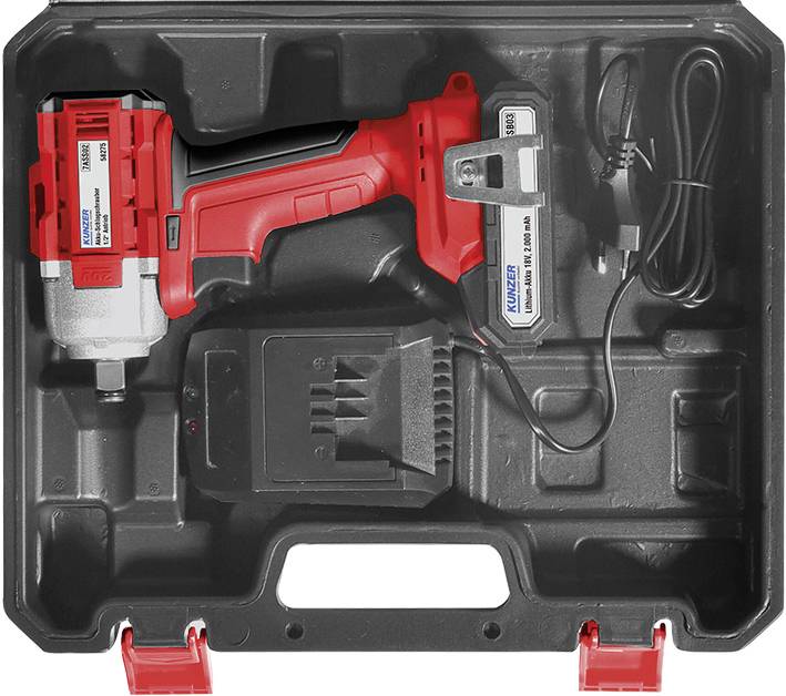 Un kit di avvitatore ad impulsi a batteria rosso in una scatola di plastica nera con caricabatterie e batteria.