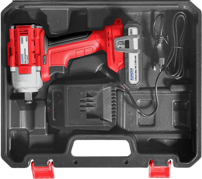 Un avvitatore rosso e argento in una scatola di plastica nera con caricabatterie e batteria. Include accessori e cavi.