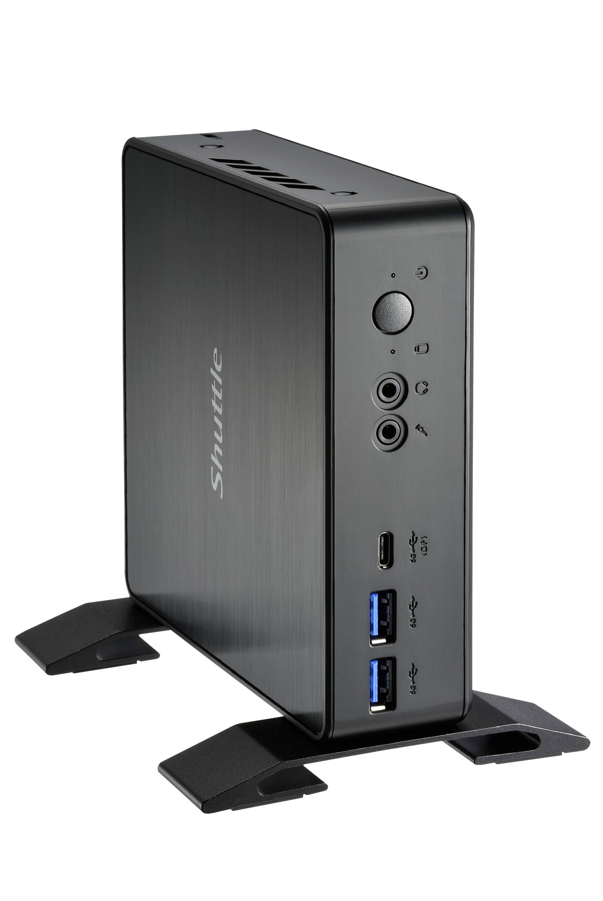 Un mini PC compatto nero con posizionamento verticale, molteplici porte di connessione e un pulsante di accensione sul lato frontale.