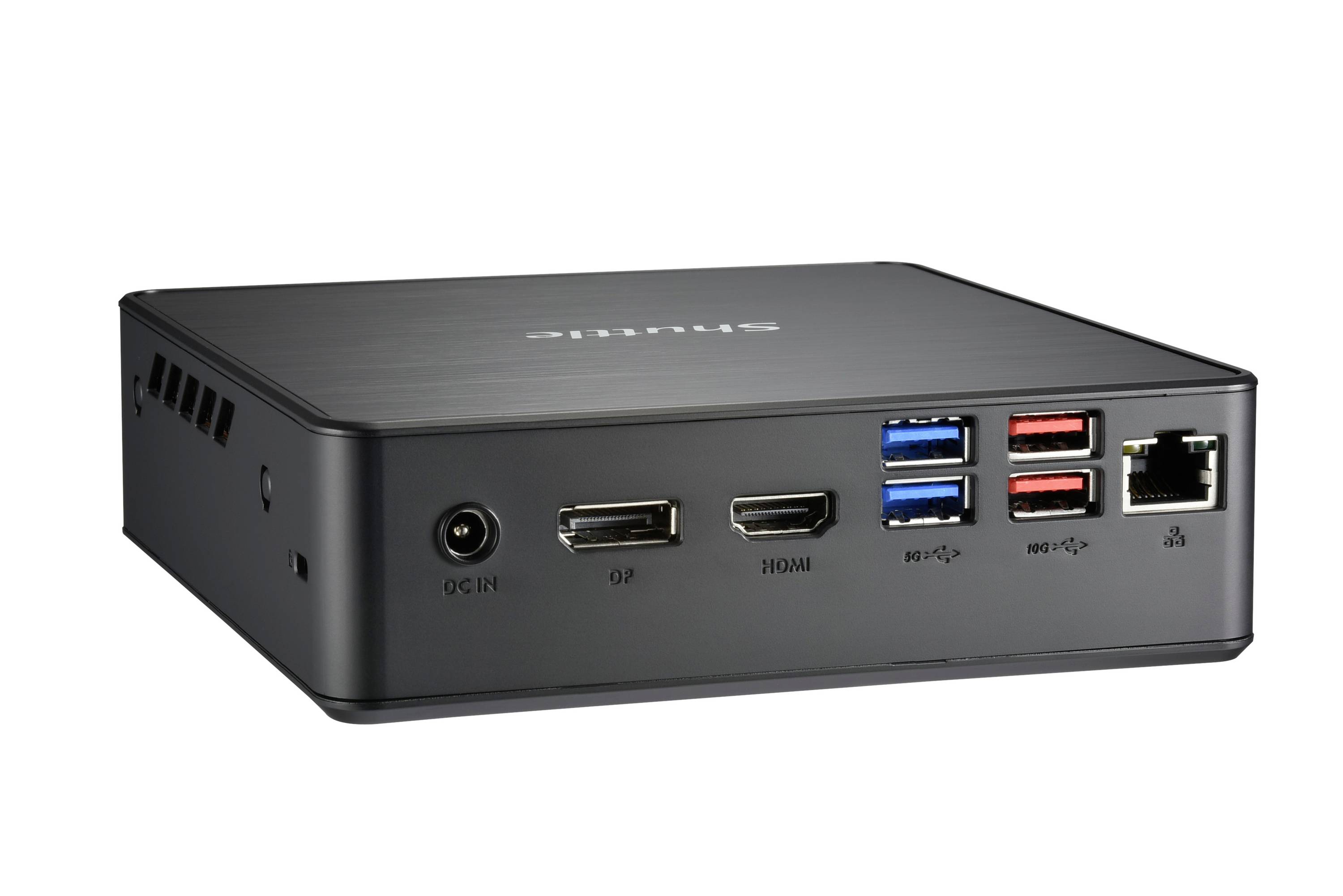 Un mini PC nero con diverse porte, tra cui USB, HDMI ed Ethernet, su una superficie bianca.