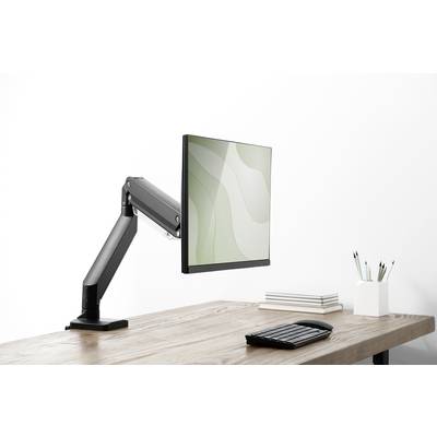 Un monitor su un braccio regolabile su una scrivania con tastiera e portapenne. Sullo sfondo una parete neutra.