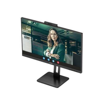 Una donna vestita di verde sorride in una scena di videochiamata su un monitor del computer.