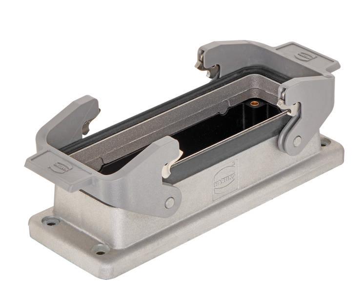 Un involucro di connessione rettangolare grigio con un coperchio aperto, idoneo per connettori industriali.