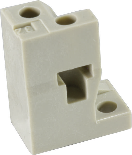 Blocco rettangolare in plastica color crema con tre fori e rientranze, probabilmente parte di un sistema tecnico o meccanico.