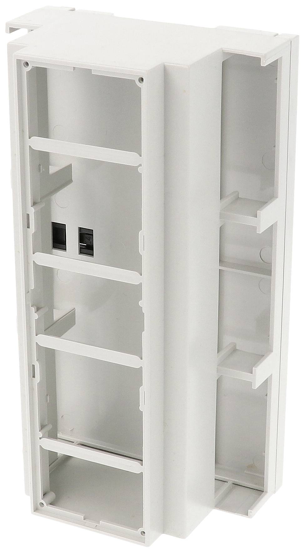 Cornice rettangolare bianca in plastica, probabilmente per installazioni elettroniche o edili. Contiene diversi scomparti e due interruttori neri.