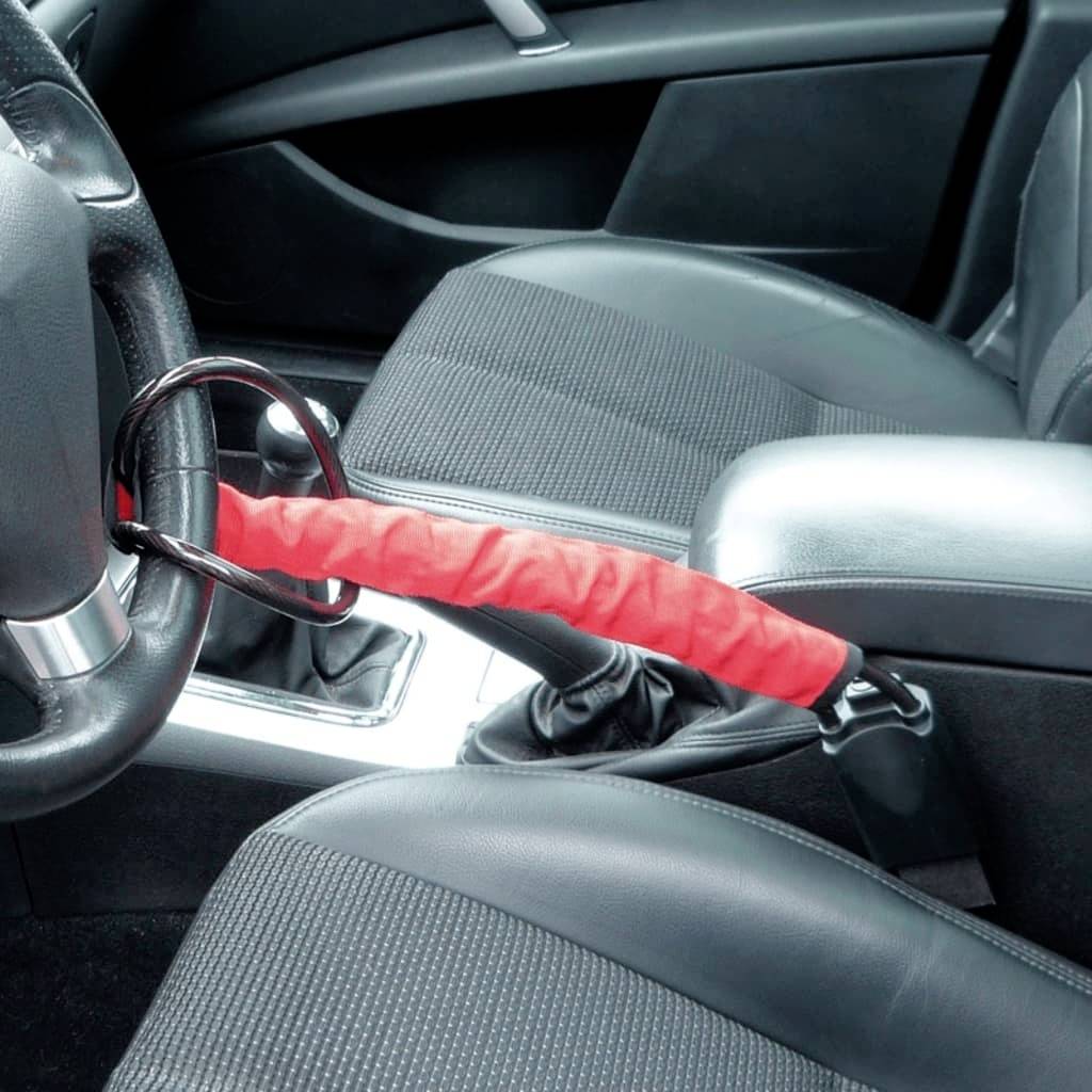 Un bloccasterzo collega il volante e la leva del cambio in un'auto per prevenire il furto. Il bloccasterzo è rosso.