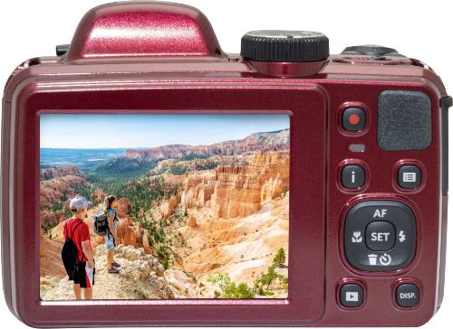Una fotocamera con uno schermo mostra due persone in piedi sul bordo di un paesaggio di canyon dai colori vivaci.