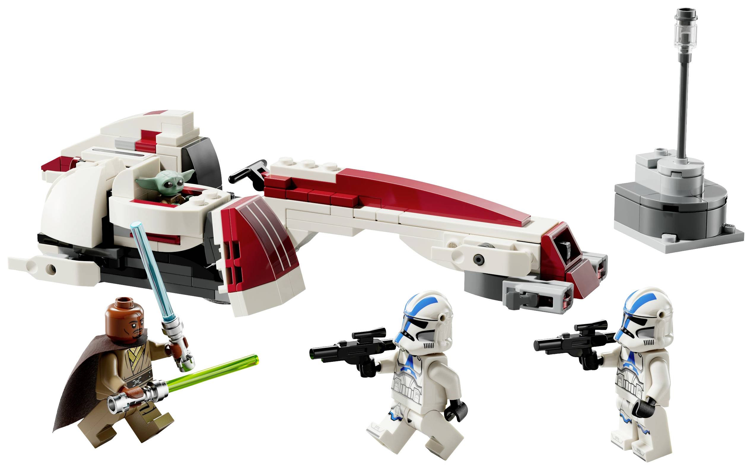 Set Lego con astronave, due figure con armi, una figura con spada laser e una piccola figura verde accanto a un oggetto grigio.