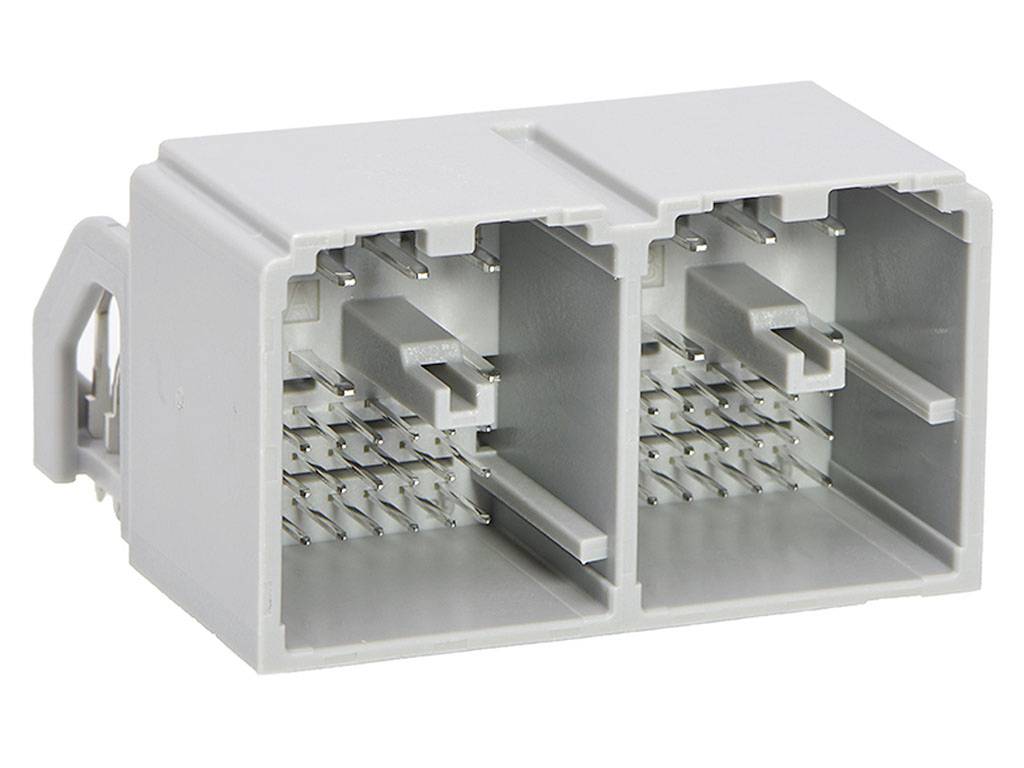 Connettore elettrico rettangolare grigio con più contatti a pin e a innesto disposti su due file, utilizzato per applicazioni industriali.