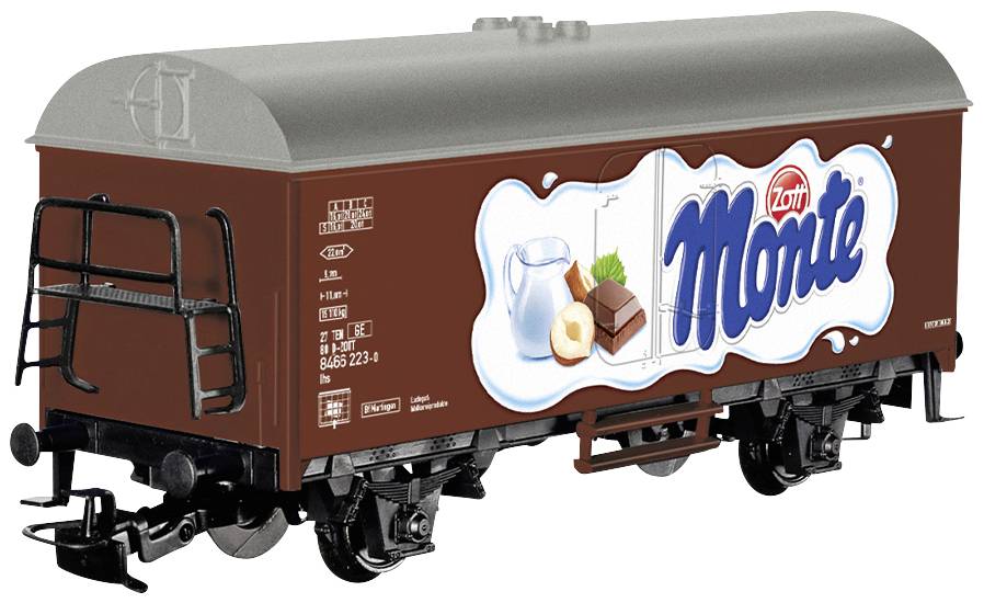Vagone giocattolo per treno con logo 'Zott Monte', raffigurante latte, nocciola e cioccolato sul lato, sullo sfondo bianco.