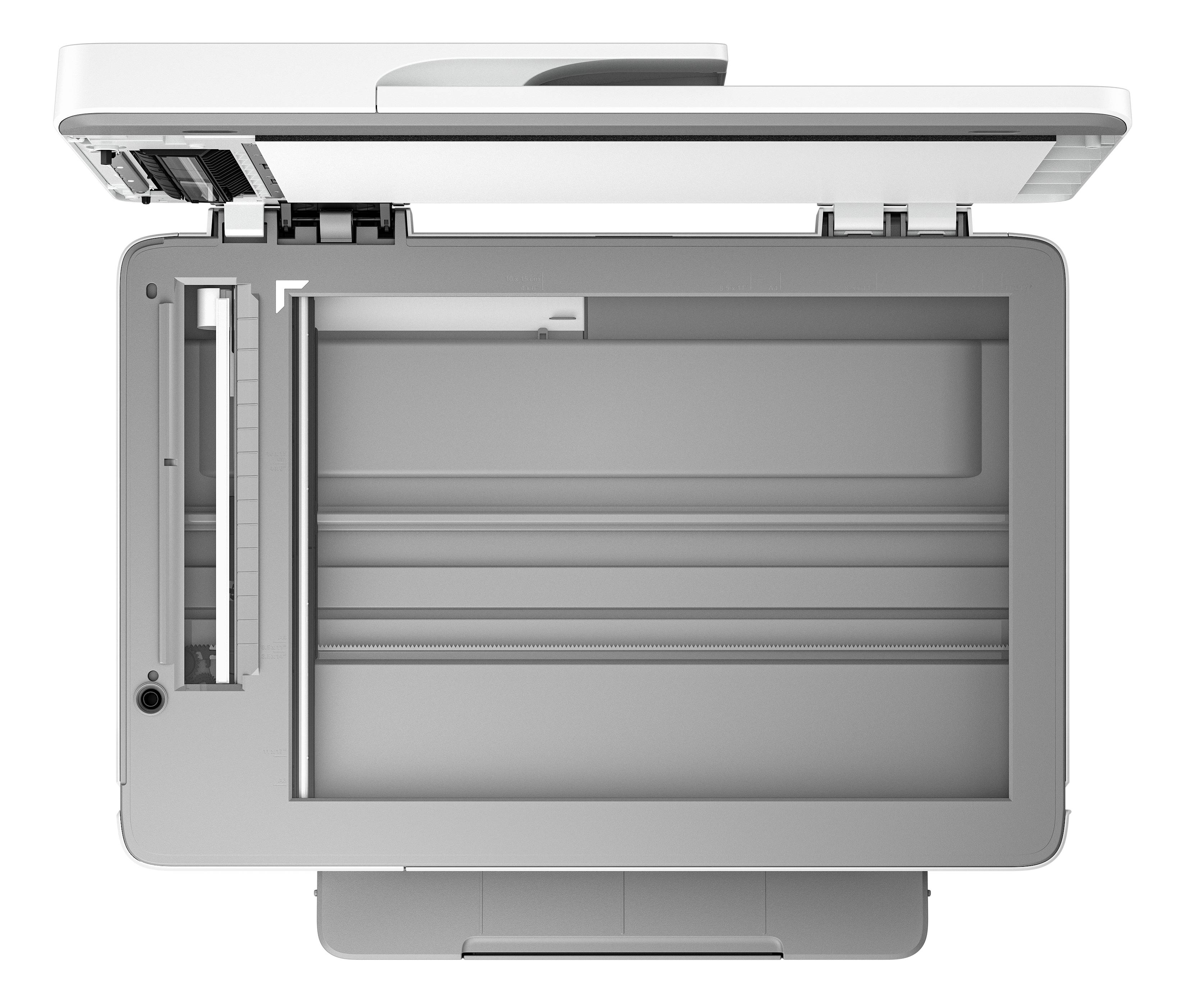 Un scanner a flatbed aperto, vista dall'alto. Sono visibili la superficie di scansione e il coperchio.